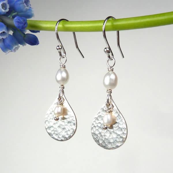 Silver and pearl earrings.